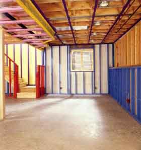 Basements often have heat ducts, pipes, wiring and exposed concrete walls and floors that need to be dealt with to create a comfortable living space.